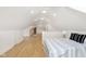 Bright bedroom featuring hardwood floors, dormer windows and a modern striped comforter set at 4226 Cornelius Ave, Indianapolis, IN 46208