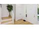 The foyer features hardwood floors, white trim and neutral paint, creating a welcoming and clean entrance at 4226 Cornelius Ave, Indianapolis, IN 46208