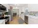 Bright kitchen with stainless steel appliances, white cabinetry, and stylish backsplash at 4226 Cornelius Ave, Indianapolis, IN 46208