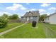 Large backyard with a lush lawn, privacy fence, and space for outdoor activities at 4813 E 11Th St, Indianapolis, IN 46201