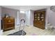 Finished basement featuring a treadmill on light wood vinyl floors and painted cinder block walls at 4813 E 11Th St, Indianapolis, IN 46201