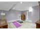 Basement featuring a treadmill on light wood vinyl floors and painted cinder block walls at 4813 E 11Th St, Indianapolis, IN 46201