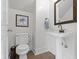 Powder room with pedestal sink and modern fixtures at 4813 E 11Th St, Indianapolis, IN 46201