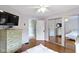Bedroom featuring a large dresser, mirrored closet, and hardwood floors at 4813 E 11Th St, Indianapolis, IN 46201