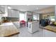 Bright eat-in kitchen featuring white cabinets, stainless steel appliances, butcher block counters, and an island at 4813 E 11Th St, Indianapolis, IN 46201