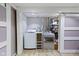 Laundry room featuring modern washer and dryer units and convenient sliding door access at 4813 E 11Th St, Indianapolis, IN 46201