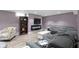 Basement living room showcasing a cozy grey sectional, modern fireplace, and neutral decor at 4813 E 11Th St, Indianapolis, IN 46201