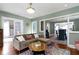 Inviting living room with hardwood floors, cozy sofa, and charming decor at 4813 E 11Th St, Indianapolis, IN 46201