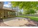 Inviting backyard offers a concrete patio, a screened porch, landscaping and a wooden fence at 5037 Surrey Ln, Carmel, IN 46033