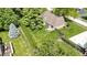 A fenced backyard boasts impeccable landscaping and lush lawns, ideal for outdoor enjoyment at 5037 Surrey Ln, Carmel, IN 46033