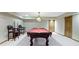 Finished basement featuring a pool table, pendant lighting, neutral walls, and carpet floors at 5037 Surrey Ln, Carmel, IN 46033