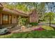Attractive brick home featuring a landscaped entrance and a two-car attached garage at 5037 Surrey Ln, Carmel, IN 46033