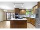 Well-lit kitchen with stainless steel appliances and center island at 5037 Surrey Ln, Carmel, IN 46033