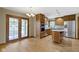 Open kitchen features stainless steel appliances, wood cabinets, and an island at 5037 Surrey Ln, Carmel, IN 46033