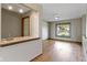 The open living space includes a bar area, bright windows, and hardwood floors, ideal for entertaining at 5037 Surrey Ln, Carmel, IN 46033