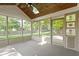 Relaxing screened-in porch featuring a wood ceiling, skylight, decorative glass, and lovely views of the backyard at 5037 Surrey Ln, Carmel, IN 46033