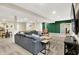 Spacious basement with a large couch, a sliding door, a tv, and a mini kitchen at 5668 Champion Way, Greenwood, IN 46143