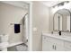 Well-lit bathroom featuring modern fixtures, vanity with white marble countertops and tile flooring at 5668 Champion Way, Greenwood, IN 46143