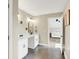 Bright, spacious bathroom with double vanity, marble countertop and dark floor at 5668 Champion Way, Greenwood, IN 46143