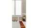 Close up on a bathtub with a wooden tray, window, and accessories at 5668 Champion Way, Greenwood, IN 46143
