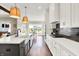 Bright kitchen showcases large island, modern appliances, and seamless flow to dining area at 5668 Champion Way, Greenwood, IN 46143