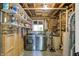 Unfinished basement laundry room with washer, dryer, shelving, and exposed ceiling at 586 Shady Creek Dr, Greenwood, IN 46142