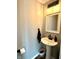 Modern powder room featuring pedestal sink, sleek fixtures, and stylish decor at 586 Shady Creek Dr, Greenwood, IN 46142