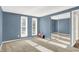 Bedroom with carpet, blue walls, two windows, and a closet at 586 Shady Creek Dr, Greenwood, IN 46142