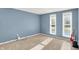 Bedroom with two windows, blue walls, and carpet at 586 Shady Creek Dr, Greenwood, IN 46142