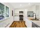 Modern kitchen showcasing white cabinets, granite counters, stainless steel appliances, and hardwood floors at 586 Shady Creek Dr, Greenwood, IN 46142