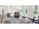 Cozy living room with comfortable seating, bright windows, and stylish wood floors at 586 Shady Creek Dr, Greenwood, IN 46142