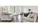 Inviting living room with comfortable seating, stylish decor, and beautiful new wood flooring at 586 Shady Creek Dr, Greenwood, IN 46142