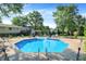 Backyard featuring a beautiful inground pool, lounge chairs, and lush landscaping at 586 Shady Creek Dr, Greenwood, IN 46142