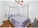 Cozy bedroom with hardwood floors, ceiling fan, and a comfortable bed at 624 10Th St, Chesterfield, IN 46017
