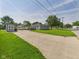 Charming home with a gray exterior, well-manicured lawn, shed, basketball hoop and long driveway at 624 10Th St, Chesterfield, IN 46017