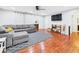 Inviting living room featuring hardwood floors, a comfortable gray sectional, and stylish decor at 624 10Th St, Chesterfield, IN 46017