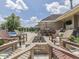 Inviting backyard patio features a cozy fire pit, pool, outdoor seating, and entertainment area at 6525 Carolina Blvd, Indianapolis, IN 46217