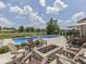 A stunning backyard features a refreshing pool, firepit, and outdoor dining area perfect for entertaining at 6525 Carolina Blvd, Indianapolis, IN 46217