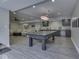 Finished basement with ping pong table, entertainment area, and bar at 6525 Carolina Blvd, Indianapolis, IN 46217