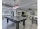 Finished basement with ping pong table, sectional sofa, and bar at 6525 Carolina Blvd, Indianapolis, IN 46217