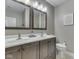 Bathroom with double sink vanity, dual mirrors, and modern fixtures at 6525 Carolina Blvd, Indianapolis, IN 46217