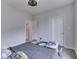 Neutral bedroom featuring a modern ceiling fan and closet access at 6525 Carolina Blvd, Indianapolis, IN 46217