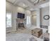 Bright living room offering tall ceilings, stone fireplace, and ample natural light at 6525 Carolina Blvd, Indianapolis, IN 46217