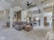 Open-concept living room with plush carpeting and easy access to the kitchen and stairway at 6525 Carolina Blvd, Indianapolis, IN 46217
