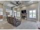 Spacious living room featuring a fireplace, coffered ceiling, and large windows at 6525 Carolina Blvd, Indianapolis, IN 46217