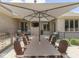 An elegant outdoor dining area with BBQ, large umbrella, and outdoor seating offers backyard enjoyment at 6525 Carolina Blvd, Indianapolis, IN 46217
