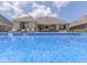 In-ground swimming pool with view of patio, outdoor kitchen, and backyard at 6525 Carolina Blvd, Indianapolis, IN 46217