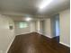 Another view of the basement with laminate flooring at 667 E Edgewood Ave, Indianapolis, IN 46227