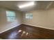 Basement view features flooring and two windows at 667 E Edgewood Ave, Indianapolis, IN 46227