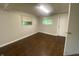View of the basement with laminate flooring and windows at 667 E Edgewood Ave, Indianapolis, IN 46227